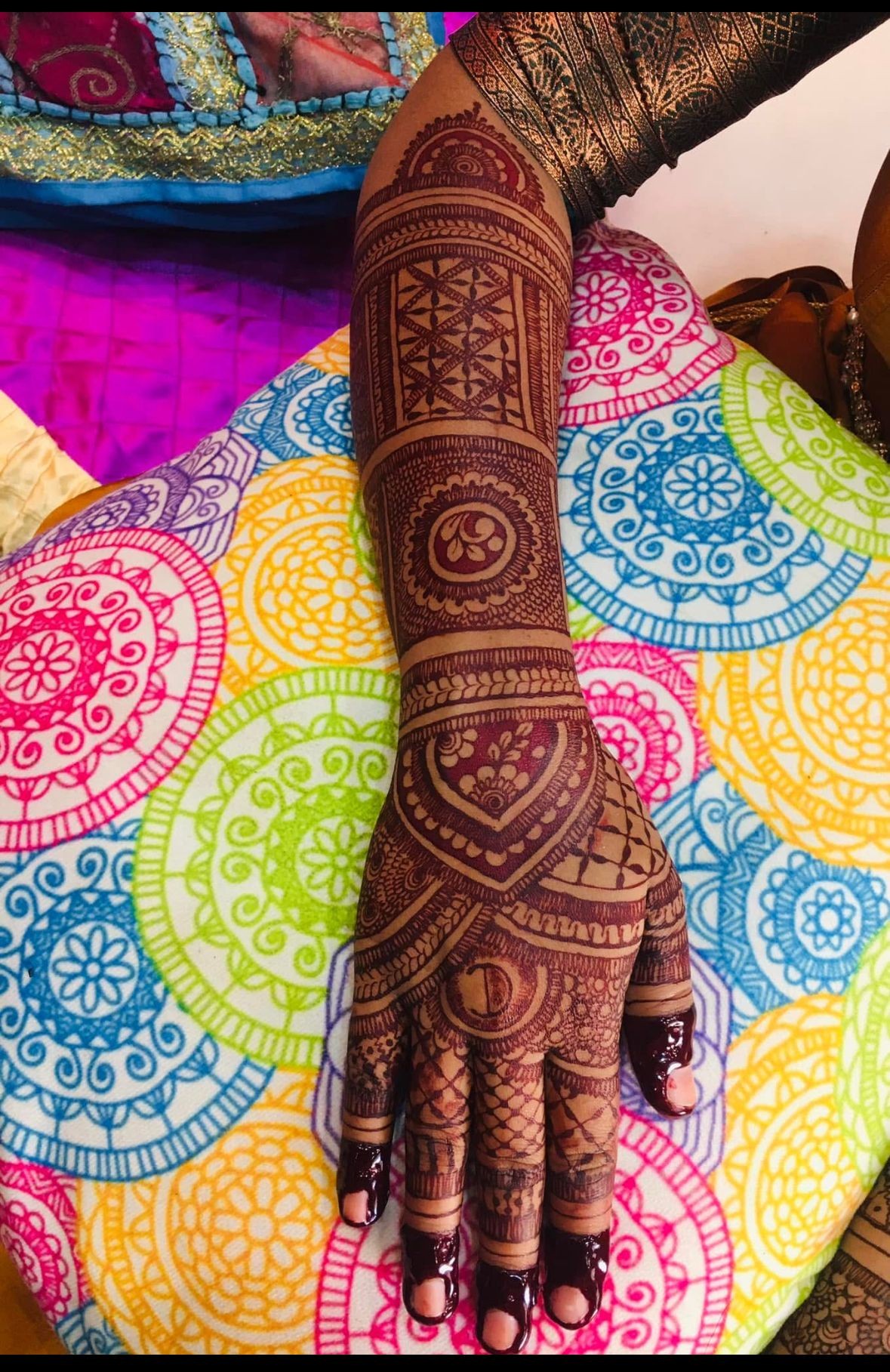 Mehendi workshop training with hands-on henna practice.